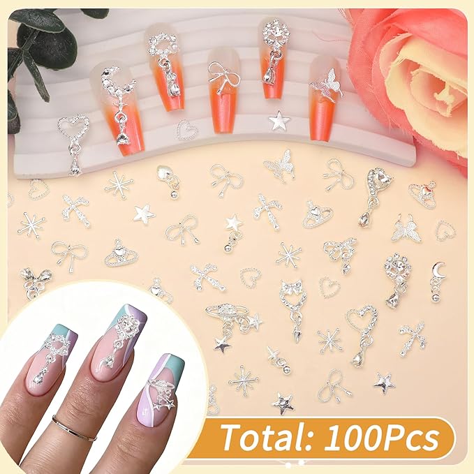 100Pcs Dangle Silver Nail Charms and Gems, Cross Star Heart Crown Planet Bows Butterfly Nail Gems Charms Silver Nails Art Supplies for Women DIY Accessories