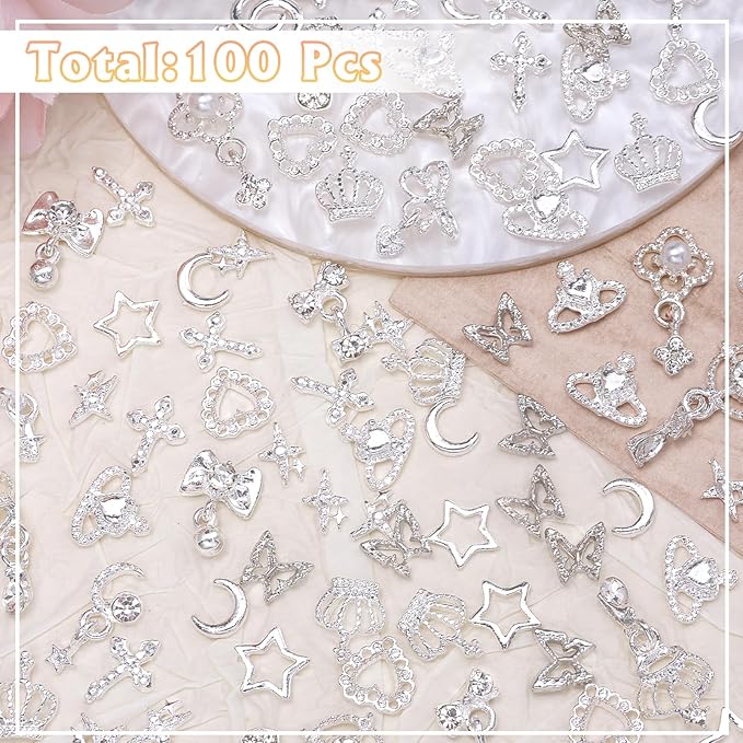 100 Pcs Silver Nail Charms and Gems, Silver Dangle Star Bows Nail Gems Charms, Metal Crown Heart Butterfly Charms for Acrylic Nail Art Alloy Cross Nail Charms for Women DIY Accessories